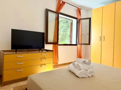 Letto o letti in una camera di Marinaway - Appartamenti a 2 chilometri dal mare
