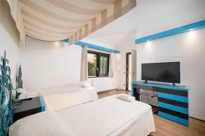 Letto o letti in una camera di Villa Puntaldia