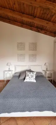 Letto o letti in una camera di Q HOME San TEODORO