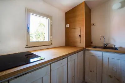 Cucina o angolo cottura di Le Case di Mara - Monte Petrosu House