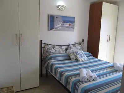 Letto o letti in una camera di Bilocale Vista Mare Le Residenze