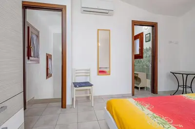 Letto o letti in una camera di Villetta Lutturai