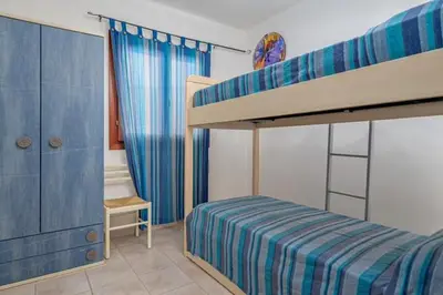 Letto o letti in una camera di Villetta Lutturai