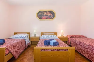 Letto o letti in una camera di Appartamenti in Villa con ampio giardino esterno