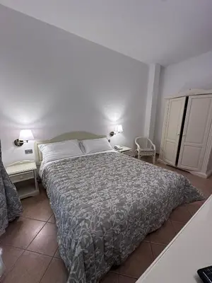 Letto o letti in una camera di Hotel Terranova