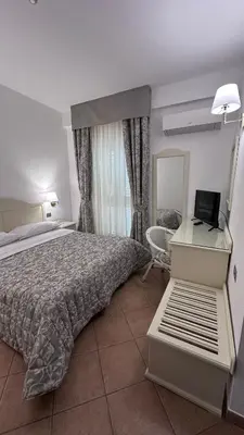 Letto o letti in una camera di Hotel Terranova