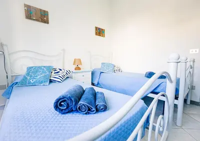 Letto o letti in una camera di Terrazza Lungomare, e sei in spiaggia...