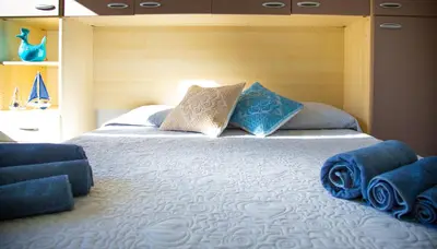 Letto o letti in una camera di Lungomare Bay, e sei in spiaggia...