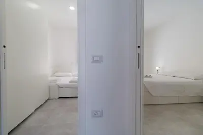Letto o letti in una camera di Appartamento Perla Bianca, con WiFi e Air Con