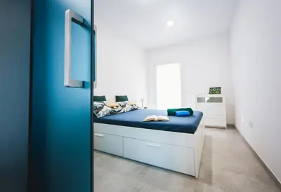 Letto o letti in una camera di Appartamento Perla Verde, WiFi e Air Con