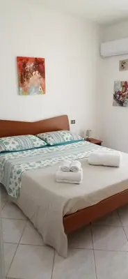Letto o letti in una camera di Casa Vacanze da PatriciaD