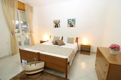 Letto o letti in una camera di casa per vacanze vicino al mare