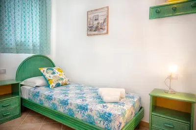 Letto o letti in una camera di Villa Isuledda Prestige