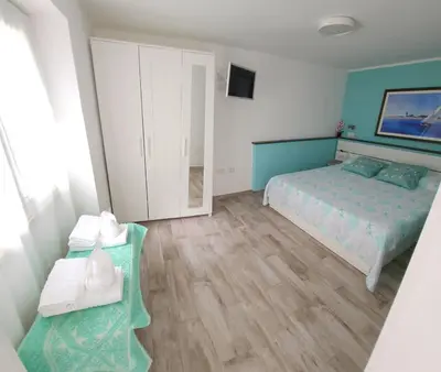 Letto o letti in una camera di Casa al mare Orchidea - Motoparking - Wifi Free - AC