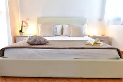 Letto o letti in una camera di Casa Basilia