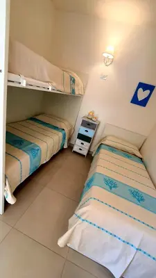 Letto o letti in una camera di Appartamento Delfino Bianco