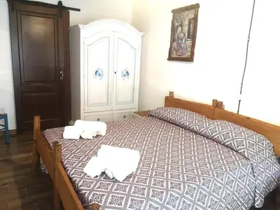 Letto o letti in una camera di Locanda Jannas