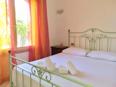 Letto o letti in una camera di Luminosa villetta a vicino al mare