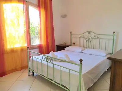 Letto o letti in una camera di Luminosa villetta a vicino al mare