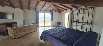 Area soggiorno di SUITE DELUXE OLBIA which wonderful view