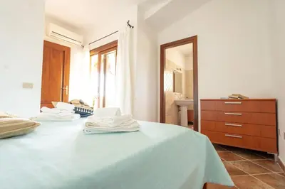 Letto o letti in una camera di Perla Marina