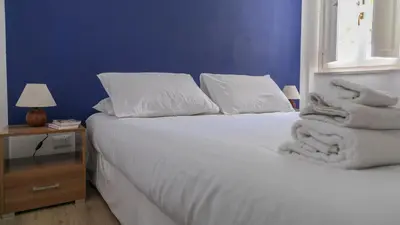 Letto o letti in una camera di Appartamenti Taloro AB IUN Q3273