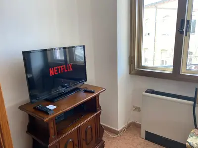 TV o dispositivi per l'intrattenimento presso Dorgali Apartment La Marmora