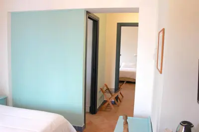 Letto o letti in una camera di BUE MARINO Hotel & Rooftop Bar