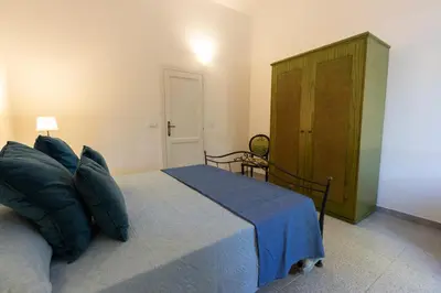 Letto o letti in una camera di Stazzo San Teodoro L'Olivastro Piscina Condivisa