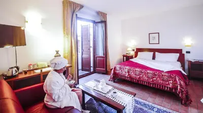 Letto o letti in una camera di Hotel Il Querceto