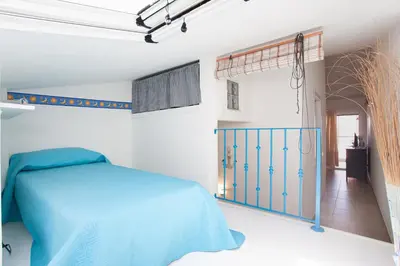 Letto o letti in una camera di Porto Coda Cavallo Beach House a 300 mt dal mare, con terrazza panoramica