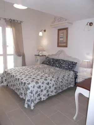 Letto o letti in una camera di La Vela suite