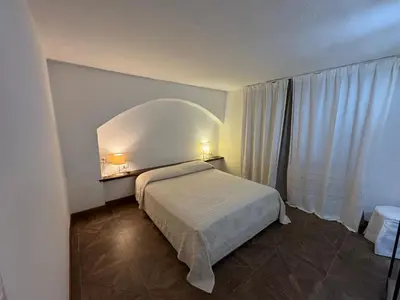 Letto o letti in una camera di Villa Fuli