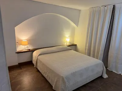 Letto o letti in una camera di Villa Fuli
