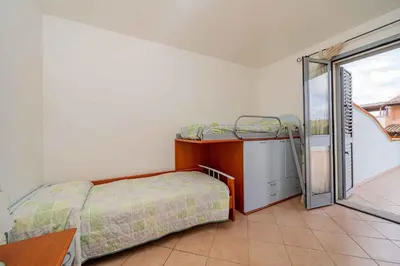 Letto o letti in una camera di Holiday home in Monte Petrosu 42788