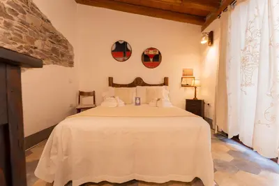 Letto o letti in una camera di Domo Dizósa