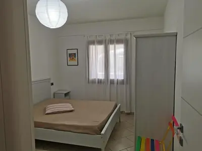 Letto o letti in una camera di RESIDENZA SARDINIA OROSEI