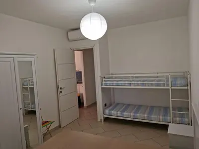 Letto o letti in una camera di RESIDENZA SARDINIA OROSEI