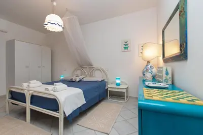 Letto o letti in una camera di Cala Liberotto-Casa relax con veranda