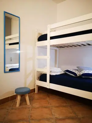 Letto o letti in una camera di Insardinia House trilocale a 200mt dalla spiaggia