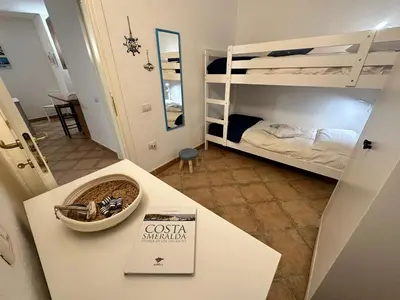 Letto o letti in una camera di Insardinia House trilocale a 200mt dalla spiaggia