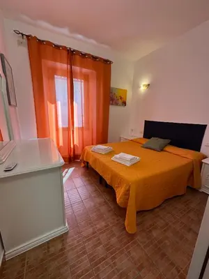 Letto o letti in una camera di Gli ulivi -Appartamento al centro
