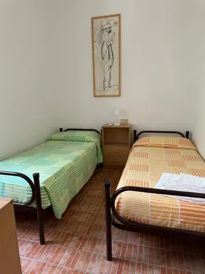 Letto o letti in una camera di Gli ulivi -Appartamento al centro
