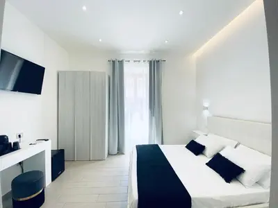 Letto o letti in una camera di International House Olbia