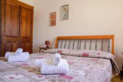 Letto o letti in una camera di Residenze di Via Magnolie