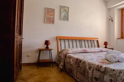 Letto o letti in una camera di Residenze di Via Magnolie