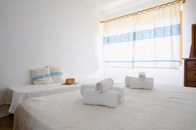 Letto o letti in una camera di Residenze di Via Magnolie