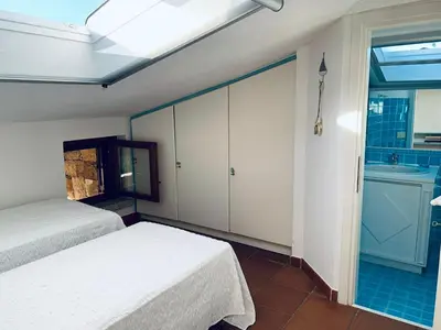 Letto o letti in una camera di BouganVilla by the Beach - San Teodoro 1