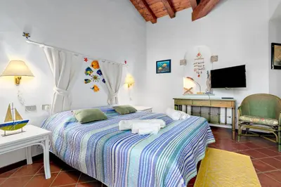 Letto o letti in una camera di Villa Miramar