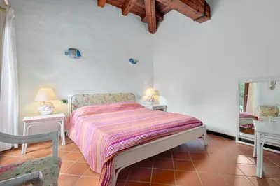 Letto o letti in una camera di Villa Miramar